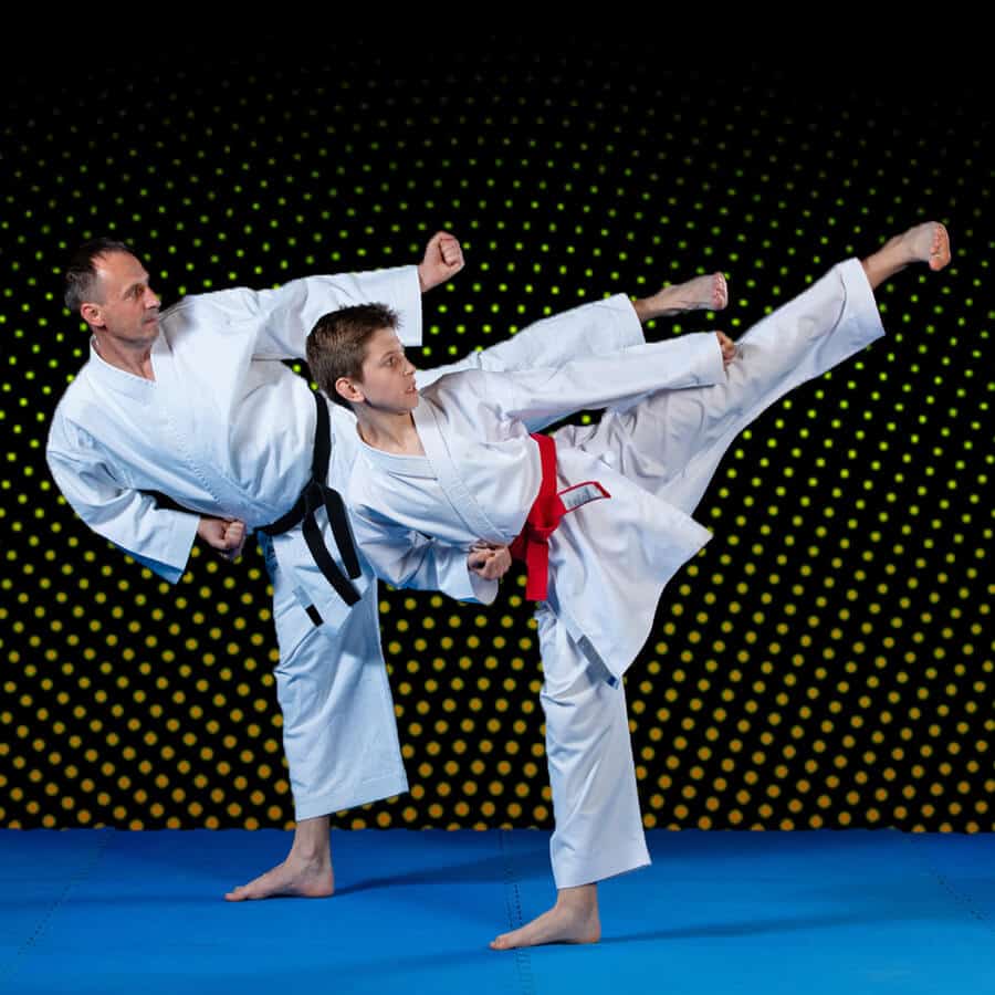 Martial Arts Lessons for Families in Broomfield CO - Dad and Son High Kick